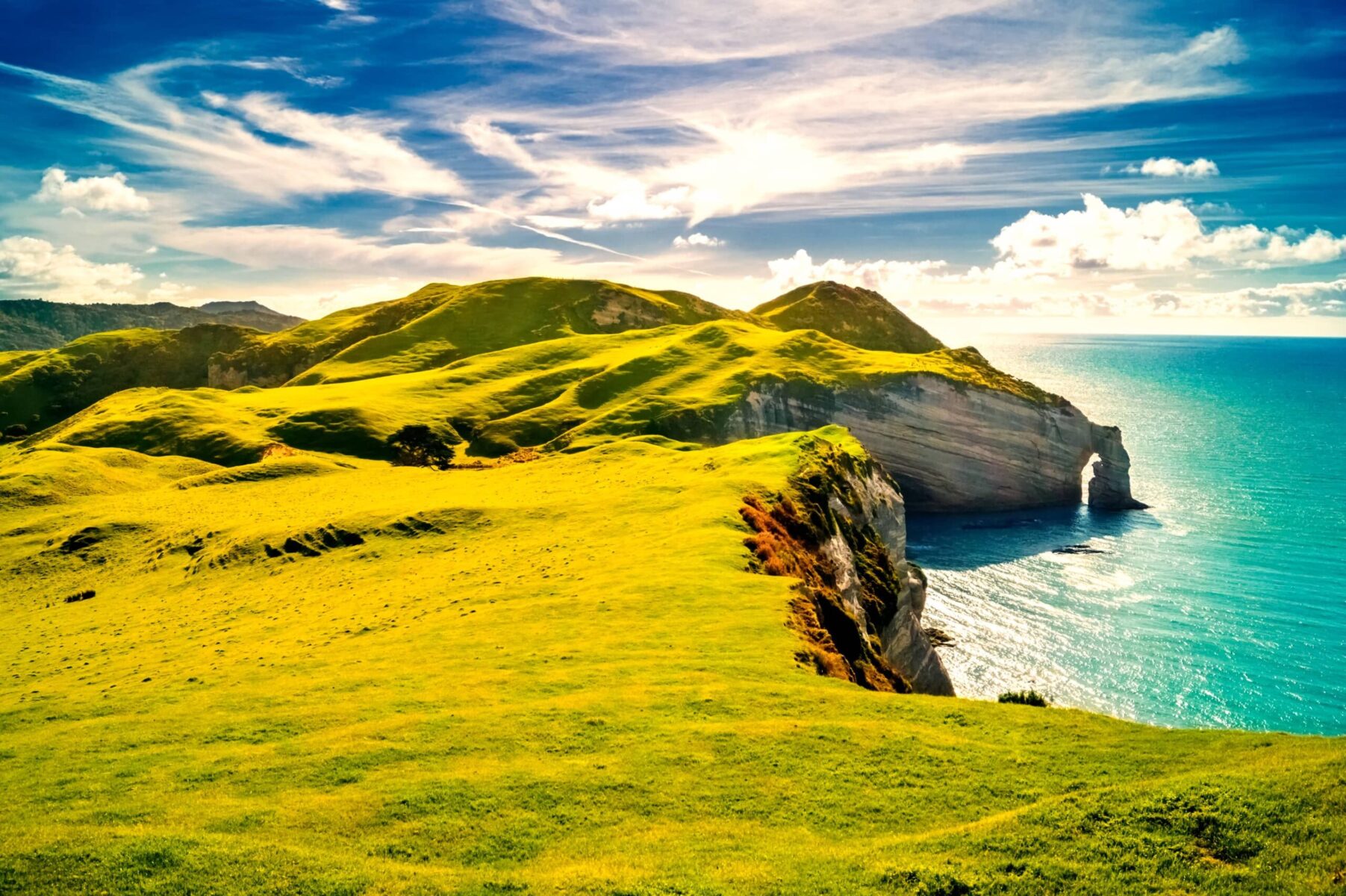 Scenic coastal cliffs and rolling green hills along the Irish coastline near Dublin.
