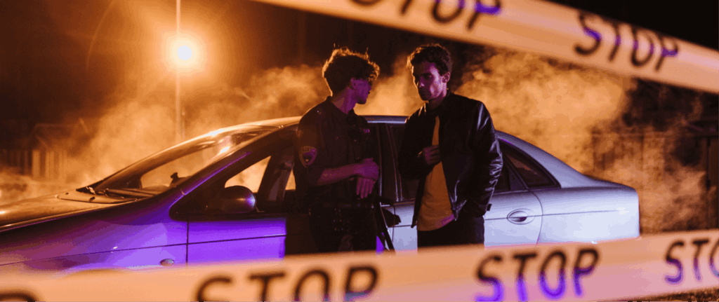 Police officer questioning a suspect at a crime scene