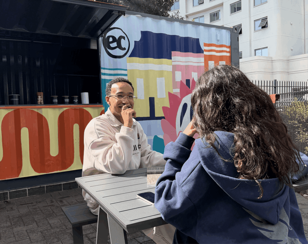 Students socialising at the outdoor coffee area at EC Cape Town