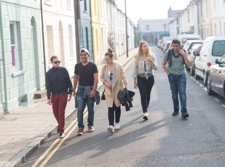 Five EC Brighton students walking through the city